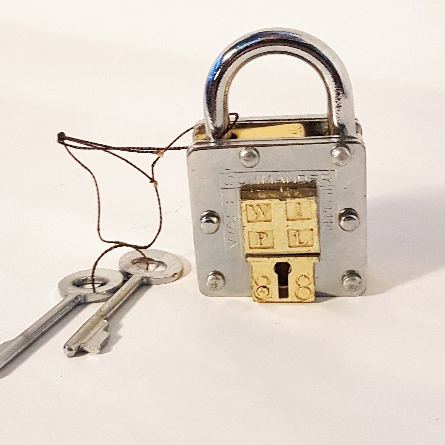Pad lock, antique 2 key puzzle lock. Functional padlock with tricky hidden keyhole. Collectible vintage design chrome & brass details.